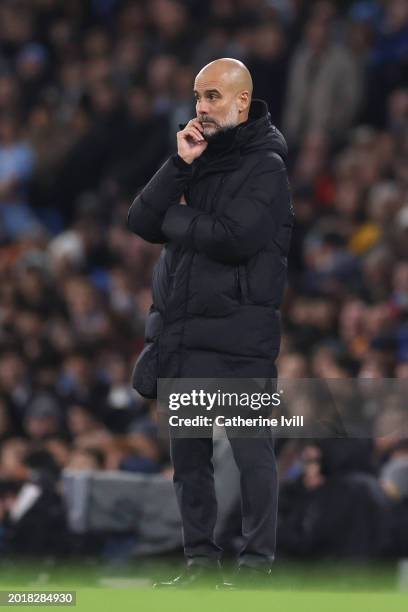 Pep Guardiola, Manager of Manchester City, looks on during the Premier League match between Manchester City and Chelsea FC at Etihad Stadium on...