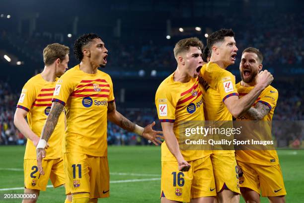 Robert Lewandowski of FC Barcelona celebrates with his team mates after scoring his teams second goal during the LaLiga EA Sports match between RC...