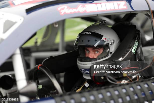 Frankie Muniz, driver of the Ford Performance Ford, sits in his car during qualifying for the NASCAR Xfinity Series United Rentals 300 at Daytona...
