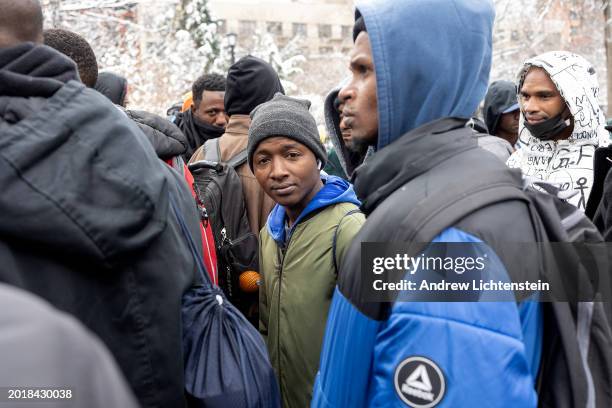 Single migrant men, mostly from West Africa, hold an impromptu meeting to discuss their lack of shelter and working papers, February 17 in Tompkins...