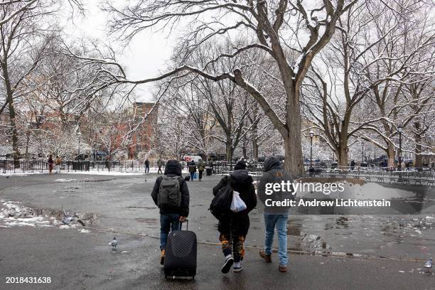 Single migrant men, mostly from West Africa, congregate in Tompkins Square Park, February 17 in the East Village neighborhood of New York City, New...