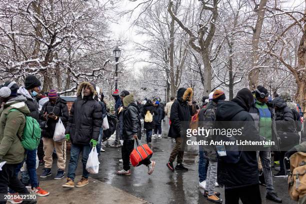 Single migrant men, mostly from West Africa, congregate in Tompkins Square Park, February 17 in the East Village neighborhood of New York City, New...