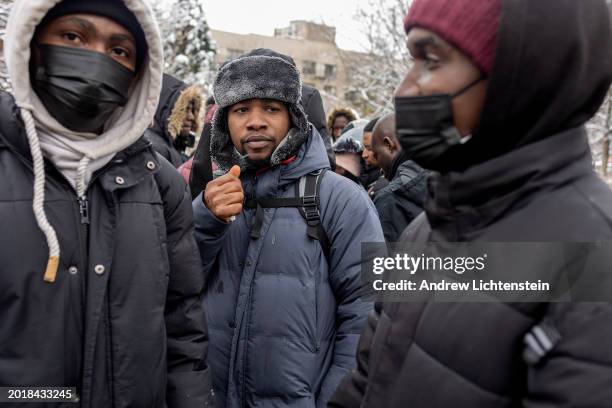 Single migrant men, mostly from West Africa, hold an impromptu meeting to discuss their lack of shelter and working papers, February 17 in Tompkins...