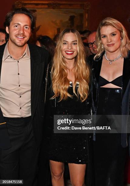 Tom Ackerley, Margot Robbie and Emerald Fennell attend the Nominees' Party for the EE BAFTA Film Awards 2024, supported by Bulgari at The National...