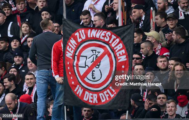 Fans of Stuttgart protest against the DFL investment plans during the Bundesliga match between SV Darmstadt 98 and VfB Stuttgart at Merck-Stadion am...