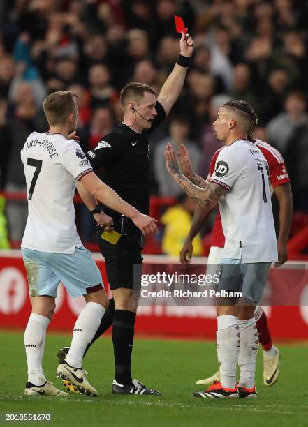 Kalvin Phillips of West Ham United receives a red card from referee Tom Brawell during the Premier League match between Nottingham Forest and West...