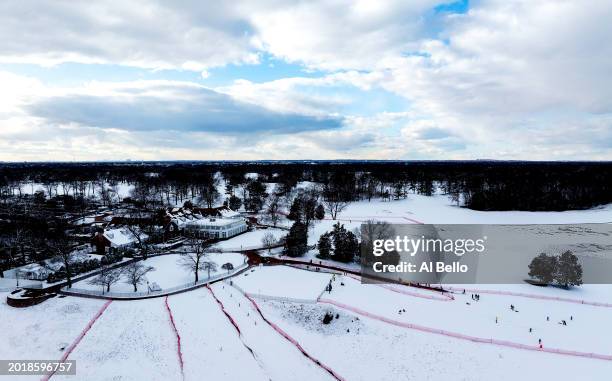 An aerial point of view of people sledding at Bethpage State Park on February 17, 2024 in Bethpage, New York. A fast-moving snowstorm left parts of...