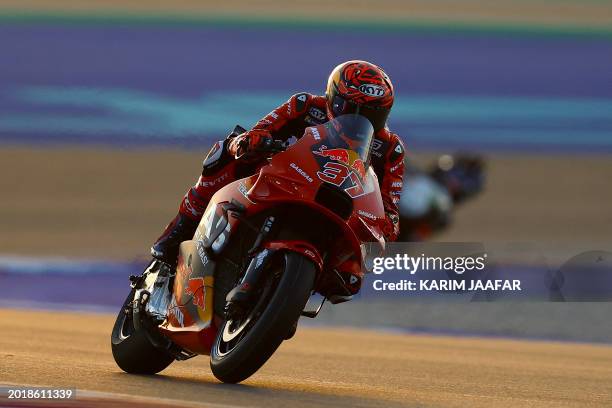 Red Bull GASGAS Tech3's Spanish rider Augusto Fernandez steers his bike on the second day of the MotoGP pre-season testing at the Lusail...