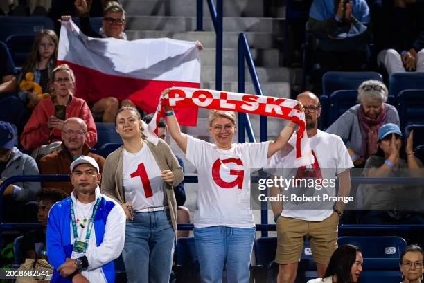 Fans cheer for Iga Swiatek of Poland during the second round on Day 3 of the Dubai Duty Free Tennis Championships, part of the Hologic WTA Tour at...