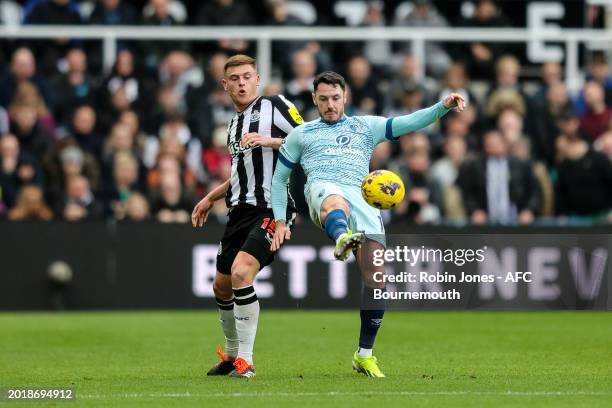 Harvey Barnes of Newcastle United and Adam Smith of Bournemouth during the Premier League match between Newcastle United and AFC Bournemouth at St....