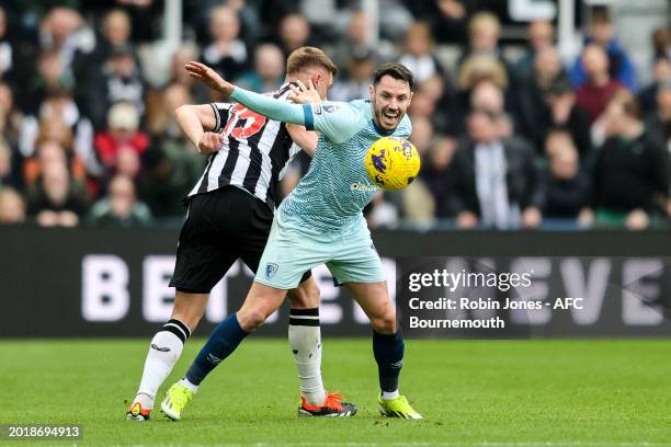 Harvey Barnes of Newcastle United and Adam Smith of Bournemouth during the Premier League match between Newcastle United and AFC Bournemouth at St....