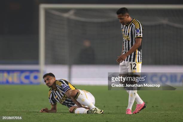 Alex Sandro of Juventus looks on as team mate Danilo reacts after taking a knock during the Serie A TIM match between Hellas Verona FC and Juventus -...