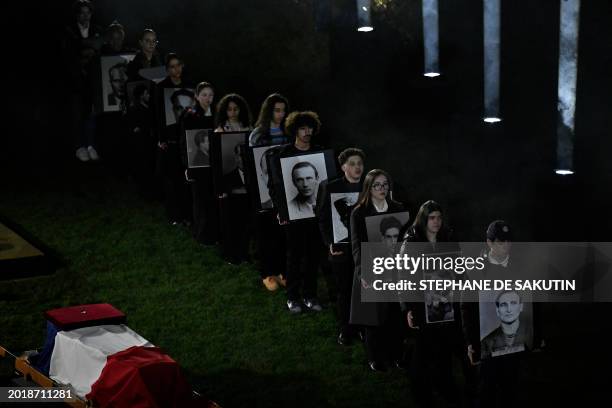 Teenagers stand by the coffin of Missak Manouchian, a hero of the French Resistance in World War II of Armenian origin who was executed by occupying...