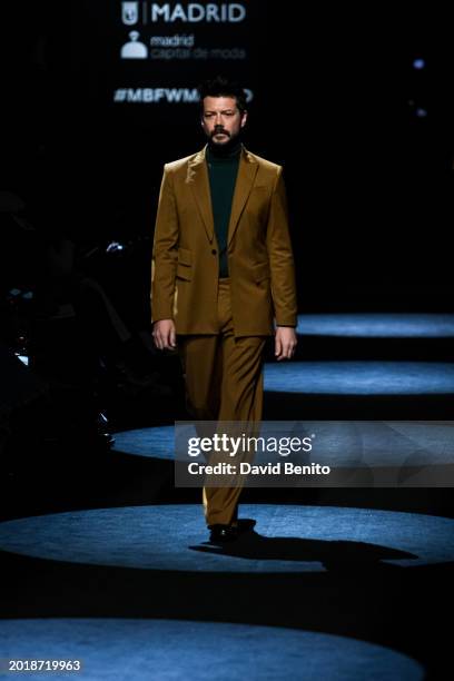 Alvaro Morte walks the runway at the Elio Berhanyer fashion show during the Mercedes Benz Fashion Week Madrid at Ifema on February 17, 2024 in...