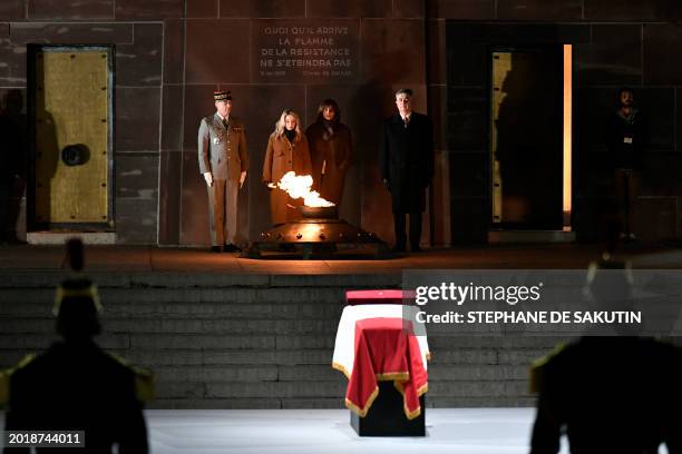 France's Secretary of State for Veterans and Memory Patricia Miralles stands by the "eternal flame of the Resistance" in front of the coffin of...