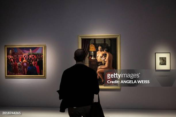 Person looks at paintings during a press preview of "The Harlem Renaissance and Transatlantic Modernism" exhibit at The Metropolitan Museum of Art on...