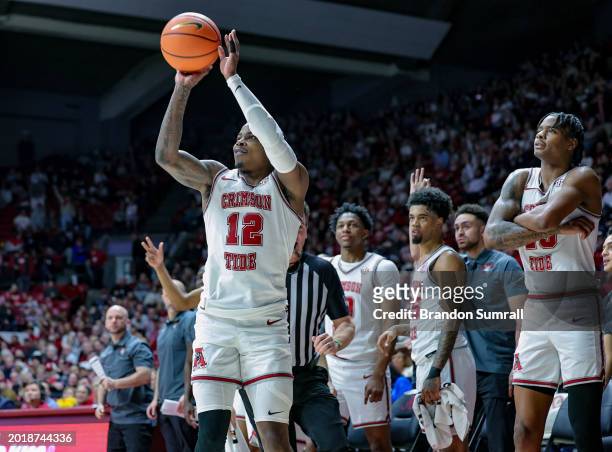 Latrell Wrightsell Jr. #12 of the Alabama Crimson Tide puts up a second half three against the Texas A&M Aggies at Coleman Coliseum on February 17,...