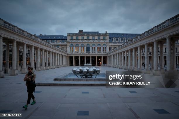 Man walks through the Palais Royal courtyard in central Paris on February 20, 2024.