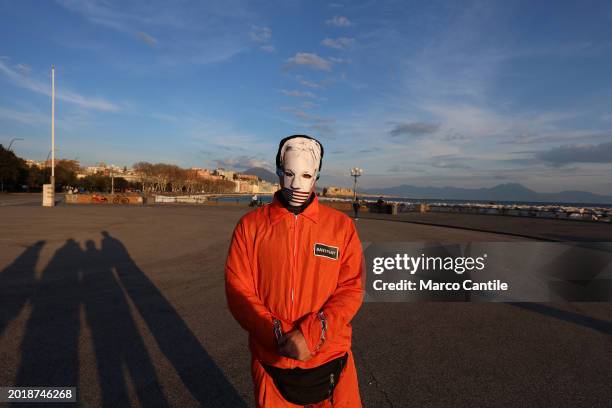 Man dressed as a prisoner and a mask with Assange's face during the demonstration in support of the activist Julian Assange, to ask that he not be...