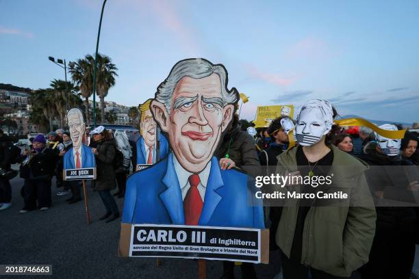 People with Assange's mask and cardboard silhouettes during the demonstration in support of the activist Julian Assange, to ask that he not be...