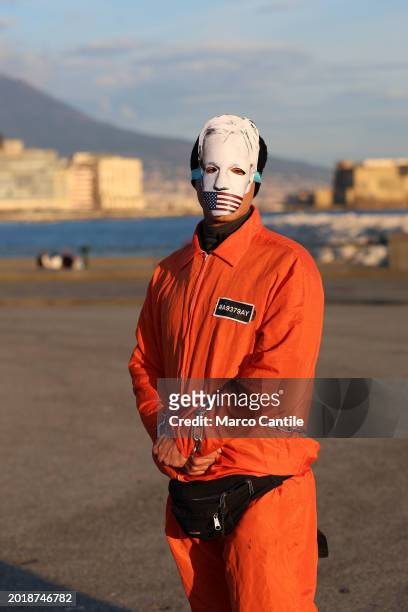 Man dressed as a prisoner and a mask with Assange's face during the demonstration in support of the activist Julian Assange, to ask that he not be...