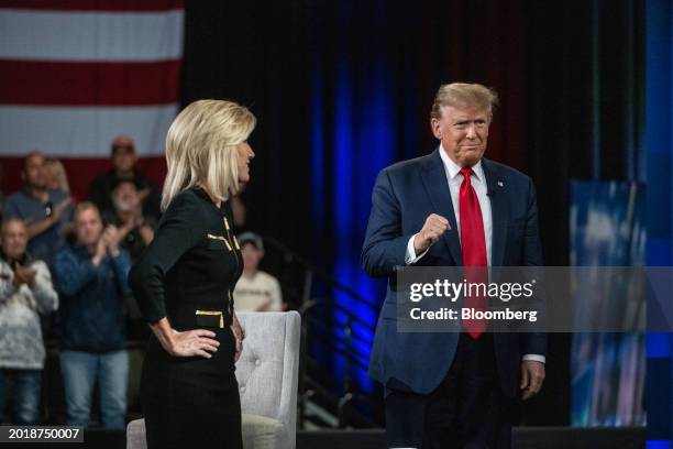 Laura Ingraham, host of The Ingraham Angle on Fox News Channel, left, watches as former US President Donald Trump arrives for a Fox News town hall in...