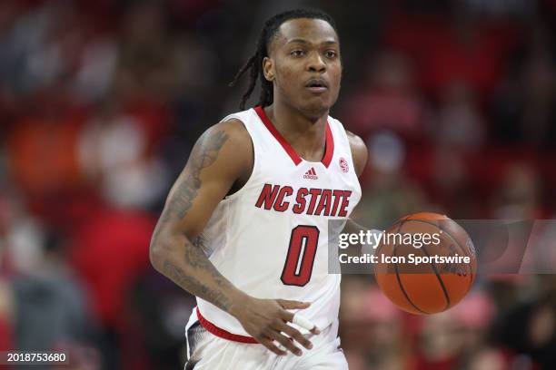 North Carolina State Wolfpack guard DJ Horne brings the ball up court during the college basketball game between the North Carolina State Wolfpack...