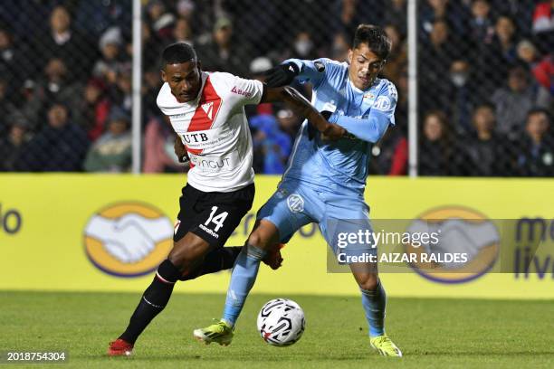 Always Ready's Ecuadorian midfielder Jose Carabali and Sporting Cristal's Argentine forward Santiago Gonzalez fight for the ball during the Copa...