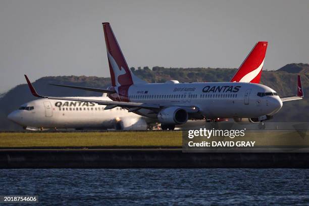 This picture taken on September 28 shows two Qantas Airways Boeing 737-800 planes on the runway at Sydney's Kingsford Smith International airport.