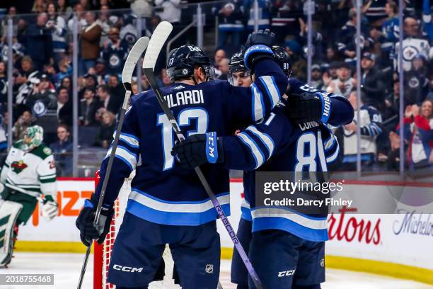 Gabriel Vilardi, Mark Scheifele and Kyle Connor of the Winnipeg Jets celebrate a second period goal against the Minnesota Wild at the Canada Life...