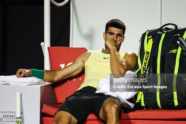 Carlos Alcaraz of Spain reacts to an injury in the men's singles round of 32 match against Tiago Monteiro of Brazil during day two of the ATP 500 Rio...