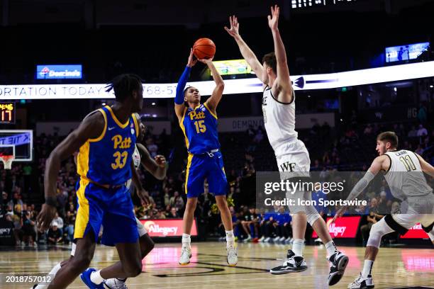 Matthew Marsh of the Wake Forest Demon Deacons defends a shot by Jaland Lowe of the Pittsburgh Panthers during a basketball game at Lawrence Joel...