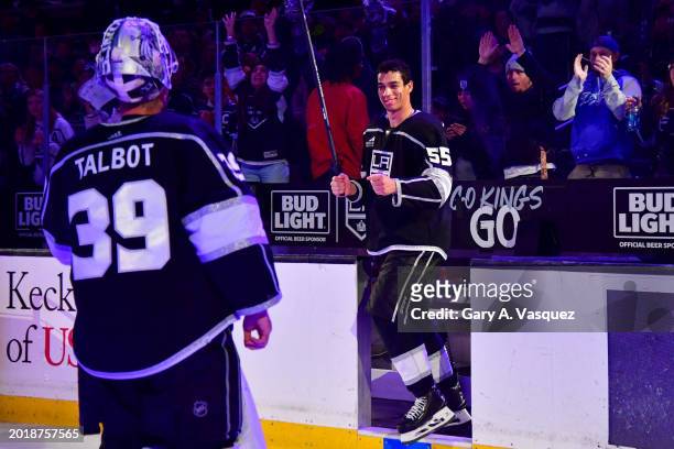 Cam Talbot of the Los Angeles Kings and Quinton Byfield celebrate after being named Stars of the Game after their victory against the Columbus Blue...