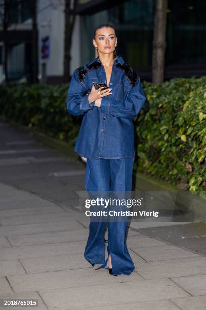 Freya Tidy wears denim shirt, jeans outside David Koma during London Fashion Week February 2024 on February 17, 2024 in London, England.