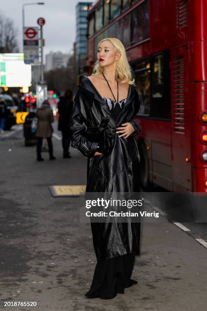 Betty Bachz wears black leather coat outside David Koma during London Fashion Week February 2024 on February 17, 2024 in London, England.