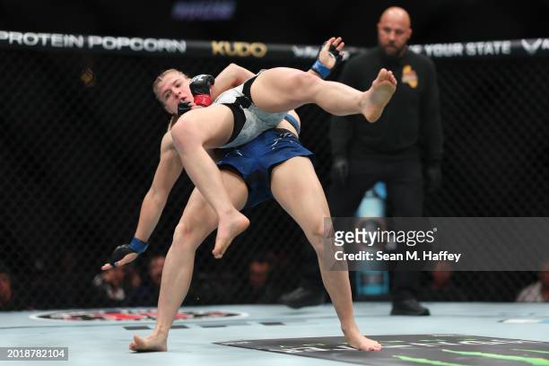 Miranda Maverick grapples with Andrea Lee during their women's flyweight fight during UFC 298 at Honda Center on February 17, 2024 in Anaheim,...