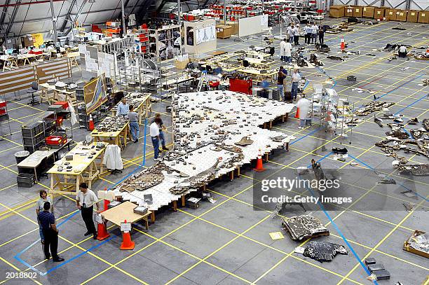 In this NASA handout, Columbia Space Shuttle debris lies floor of the RLV Hangar May 15, 2003 at Kennedy Space Center, Florida. More than 82,000...