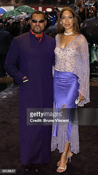 Actor Laurence Fishburne, wearing Oswald Boeteng, and wife Gina Torres attend the London premiere of "The Matrix Reloaded" at the Odeon cinema in...