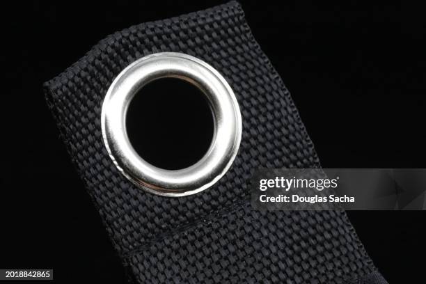 grommet on a nylon strap - tülle stock-fotos und bilder