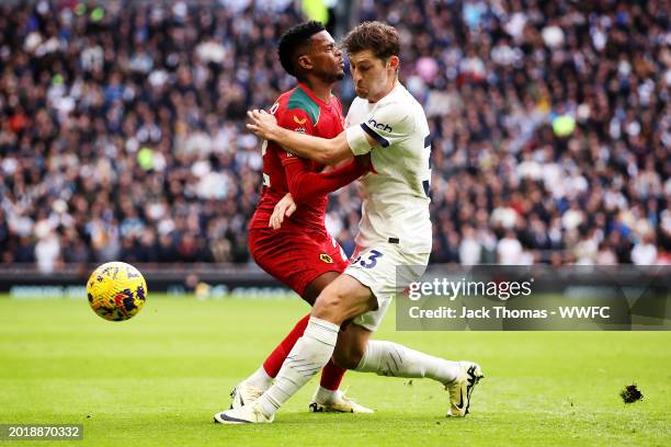 Nelson Semedo of Wolverhampton Wanderers is challenged by Ben Davies of Tottenham Hotspur during the Premier League match between Tottenham Hotspur...