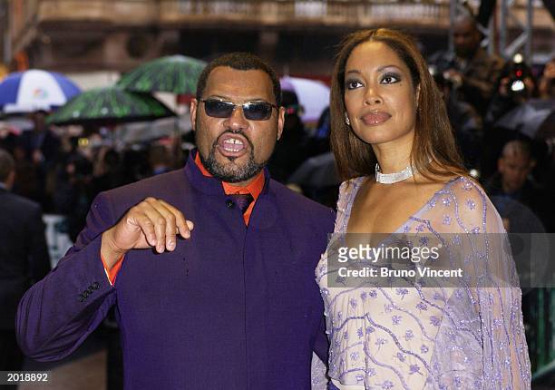 Actor Laurence Fishburne, wearing Oswald Boeteng, and his wife Gina Torres attend the London premiere of "The Matrix Reloaded" at the Odeon cinema in...