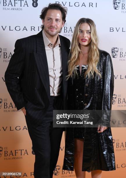 Tom Ackerley and Margot Robbie attend the EE BAFTA Film Awards 2024 Nominees' Party, supported by Bulgari at The National Gallery on February 17,...