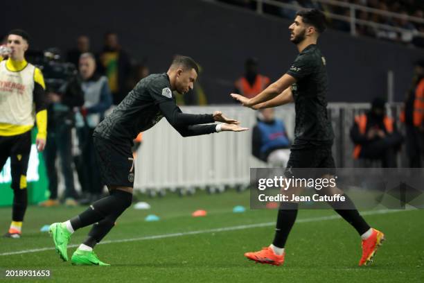 Kylian Mbappe of PSG is replacing Marco Asensio of PSG during the Ligue 1 Uber Eats match between FC Nantes and Paris Saint-Germain at Stade de la...