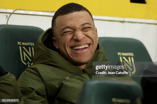 Kylian Mbappe of PSG laughs when sitting on the bench during the Ligue 1 Uber Eats match between FC Nantes and Paris Saint-Germain at Stade de la...