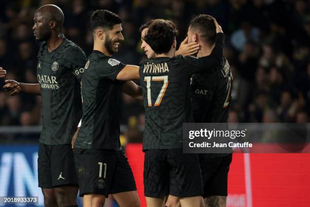 Lucas Hernandez of PSG celebrates his goal with Marco Asensio and teammates during the Ligue 1 Uber Eats match between FC Nantes and Paris...