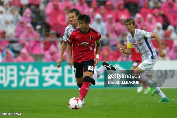 Yoichiro Kakitani of Cerezo Osaka controls the ball against Toshio Shimakawa of Ventforet Kofu during the J.League J1 match between Cerezo Osaka and...