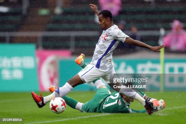 Lins of Ventforet Kofu and Kim Jin-hyeon of Cerezo Osaka compete for the ball during the J.League J1 match between Cerezo Osaka and Ventforet Kofu at...