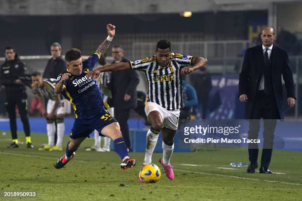 Tomas Suslov of Hellas Verona competes for the ball with Alex Sandro of Juventus during the Serie A TIM match between Hellas Verona FC and Juventus -...