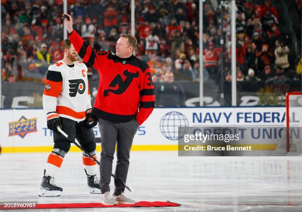 Hall of fame goaltender Martin Brodeur drops the ceremonial first puck prior to the 2024 Navy Federal Credit Union Stadium Series between the New...