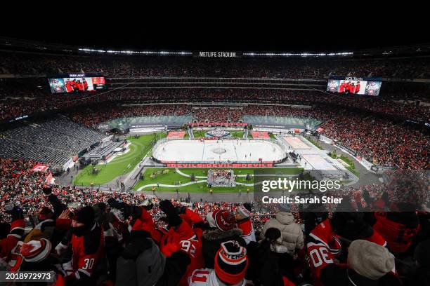 Fans celebrate a goal by Nico Hischier of the New Jersey Devils against the Philadelphia Flyers during the first period during the 2024 Navy Federal...